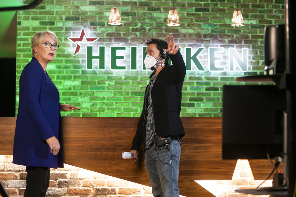 Photo behind the scenes of Lighting equipment setting the scene at a staged bar with Heineken branding