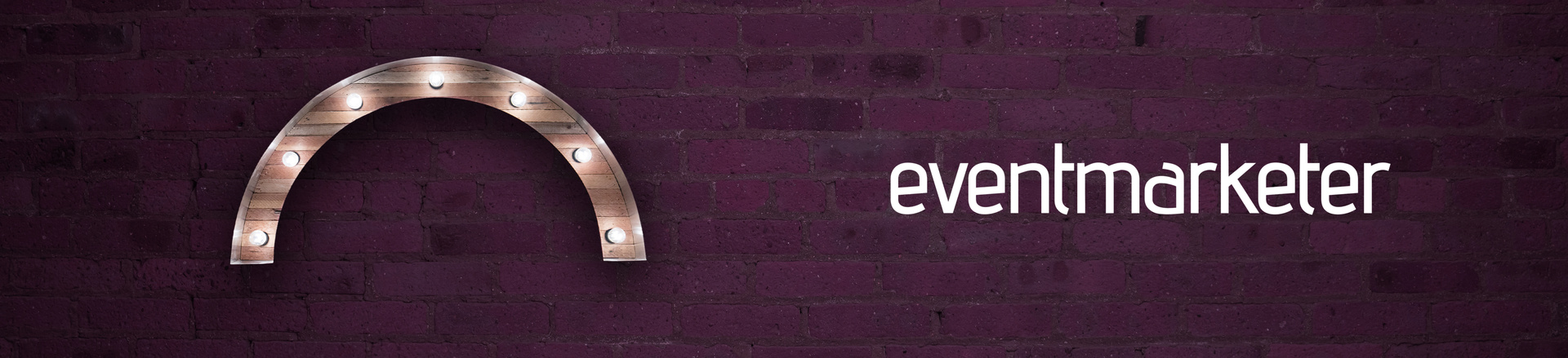 EventMarketer logo on a plum-colored brick wall background with a marquee-style arch Proscenium logo.