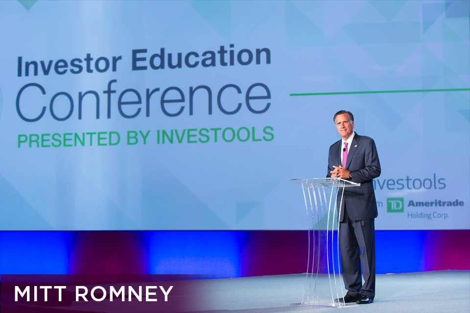 Photo of Mitt Romney standing at a clear lectern on stage speaking in front of a screen that reads "Investor Education Conference presented by Investools." Bottom left plum footer reads "Mitt Romney" 
