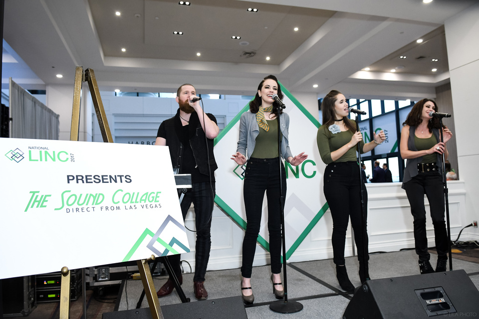 Photo of music group The Sound Collage, 4 performers, singing into microphones in front of an LINC logo.